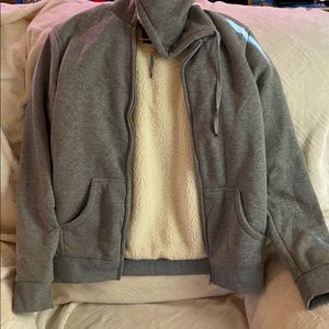 Grey sweater lined with soft faux fur.